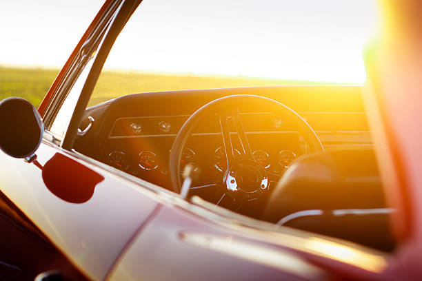 istock Retro car stay on asphalt road at sunset 532193460