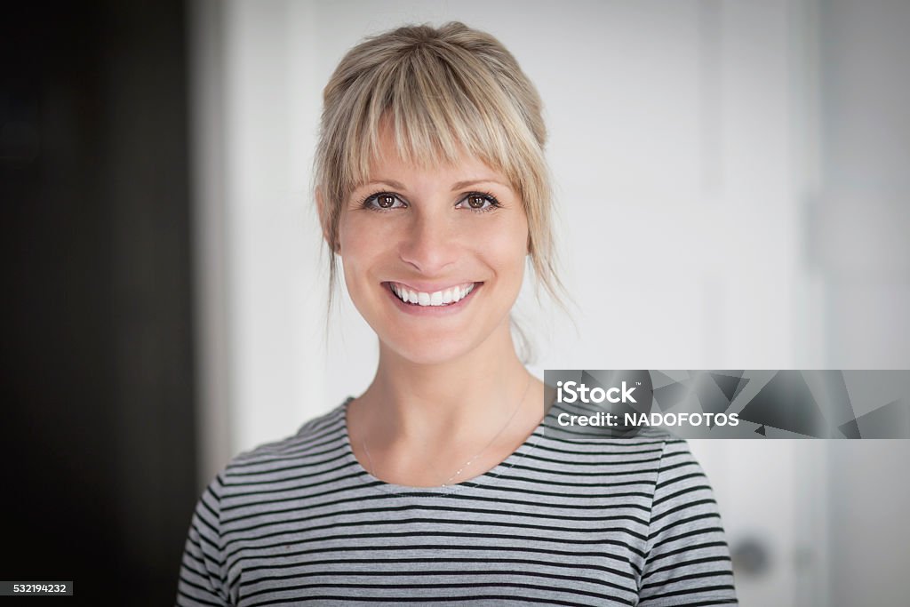 Portrait Of A Mature Woman Smiling At the Camera Portrait Of A Mature Woman Smiling At the Camera At Home One Woman Only Stock Photo