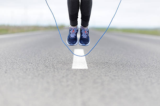 istock Woman doing jump roping on a sports field. 532194636