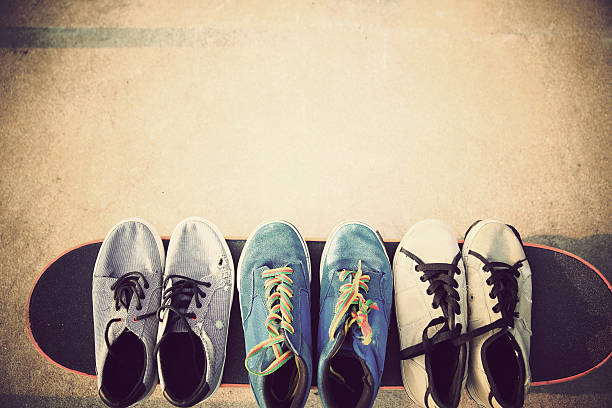 sneakers and skateboard at skatepark