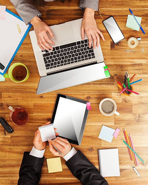 istock Man and woman working on laptops 532202527