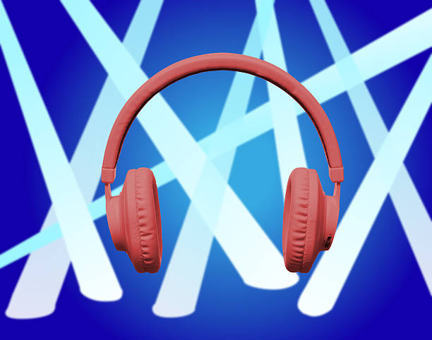 istock Red headphones on blue spotlight 532205815