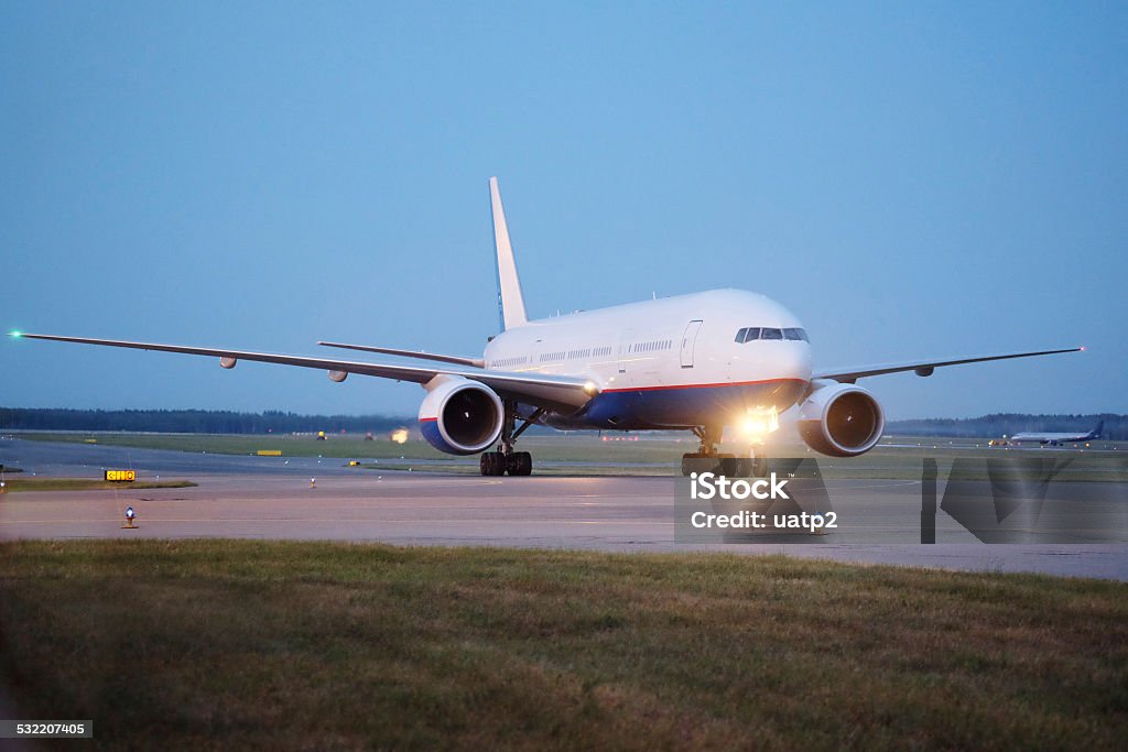 Passenger planes at the airport in the evening the image of a Passenger planes at the airport in the evening 2015 Stock Photo