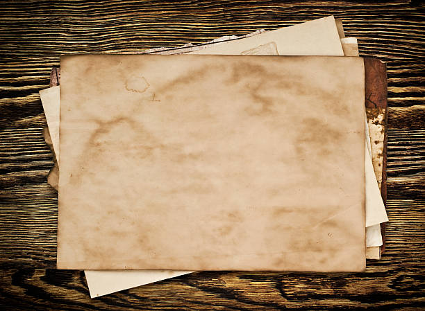 istock Old paper on the wood background 532208357