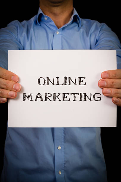 istock Man with Online Marketing sign 532208519