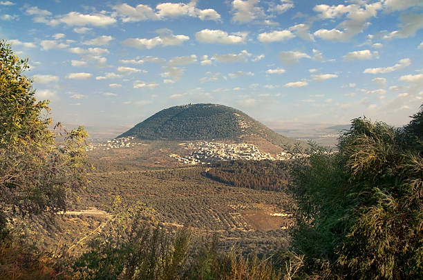 biblical Mount Tavor and the Arab village view of the biblical Mount Tabor and the Arab villages at its foot galilee photos stock pictures, royalty-free photos & images