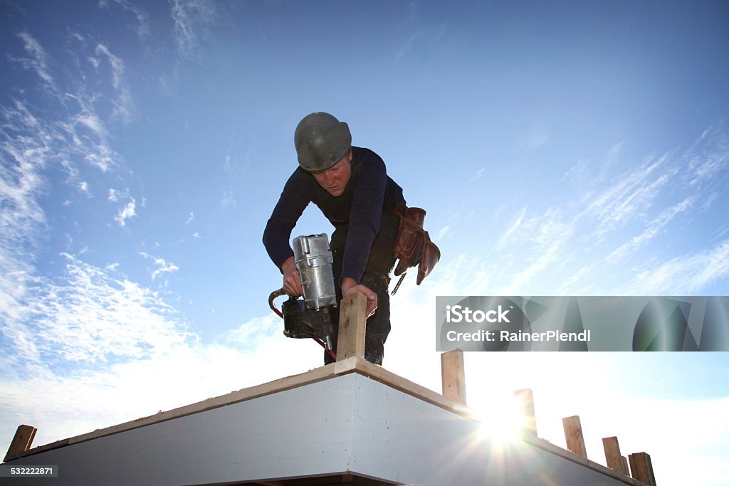 Construction worker A carpenter working on a construction site Building Contractor Stock Photo