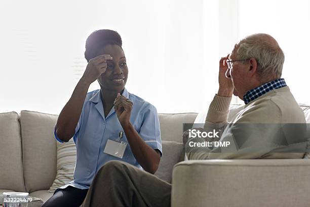 Therapist Carrying Out Eft Treatment With Elderly Patient Stock Photo - Download Image Now