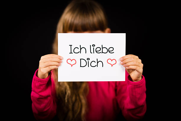 istock Child holding sign with German words Ich liebe Dich 532224629