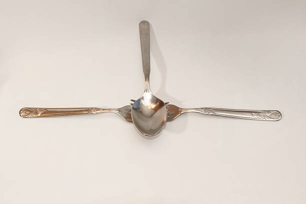istock Spoon and two forks on a white background. 532225693