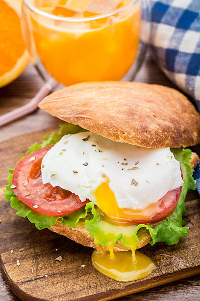 Burger with pouched egg and tomato