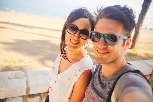 istock young couple on vacation taking a self portrait 532226077