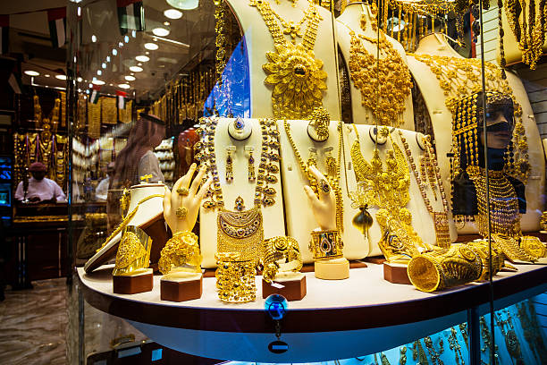 Jewelry, Gold Market Variety of golden amber rings for sale at a store souk stock pictures, royalty-free photos & images