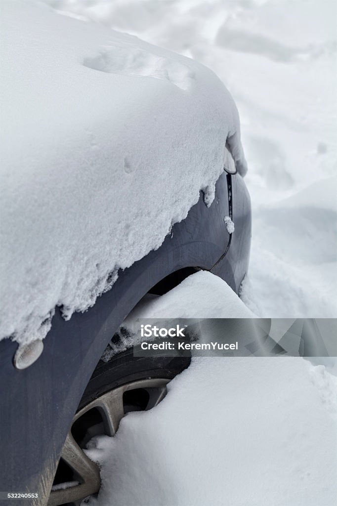 car under snow after snowfall closeup photograph of a car under snow after snowfall 2015 Stock Photo