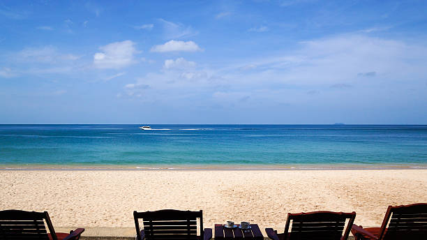 istock Beautiful empty beach with white sand and blue water with boat. 532241429