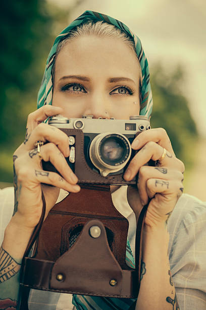 istock Young woman with the vintage camera 532241439