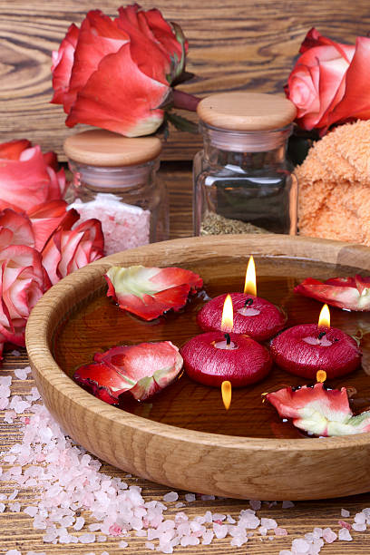 istock Spa concept with roses, pink salt and candles 532242121