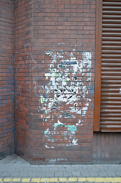 istock Graffiti and poster remains on Brick Wall, Befast, NI 532242325