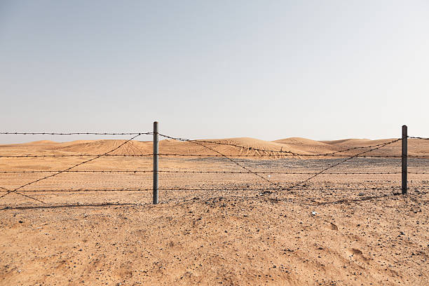 istock barbed wire fence in the desert 532242895