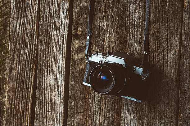 istock Vintage camera on old background of wood 532243229
