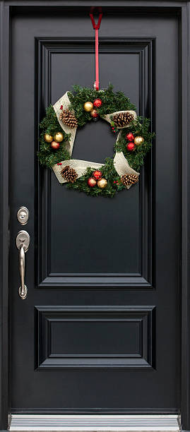 istock Christmas wreath on black door 532244823