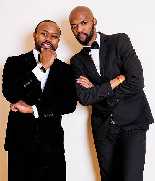 istock two afro-american businessmen in black suits emotional posing, gesturing 532255158