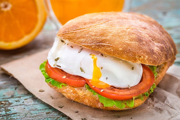 Burger with pouched egg and tomato