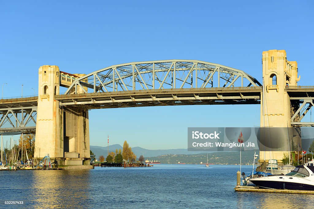 Burrard Bridge, Vancouver, BC, Canada Vancouver Burrard Bridge is an Art Deco style bridge crossing False Creek between downtown Vancouver and Kitsilano, British Columbia, Canada. 2015 Stock Photo