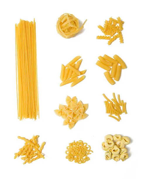 Selection of pasta on white background, Spaghetti, Penne, Tagliatelle, Fussili, Gemelli, Maccheroni, Rigatoni, Farfalle, Gobetti, Tortellini 