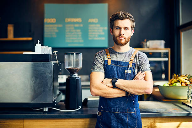 istock Confident barista standing in cafe 532258654