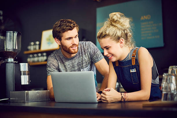 istock Baristas using laptop in coffee shop 532258950