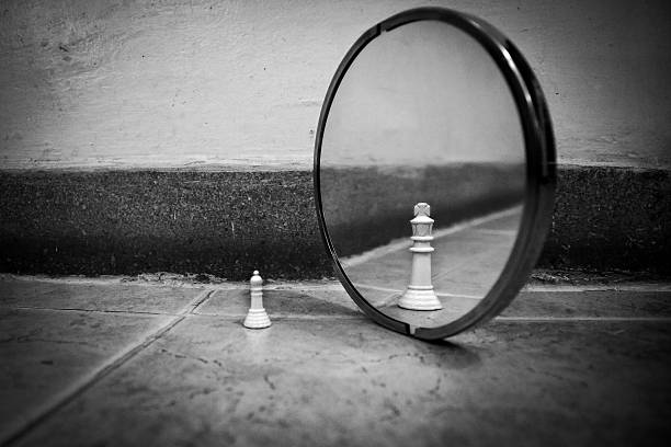 istock Pawn looking in the mirror and seeing a king 532259848