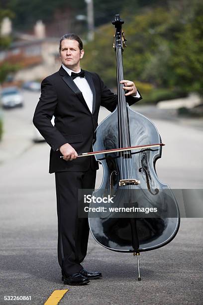 Man Playing The Double Bass In The Street Stock Photo - Download Image Now - Double Bass, 2015, Adult