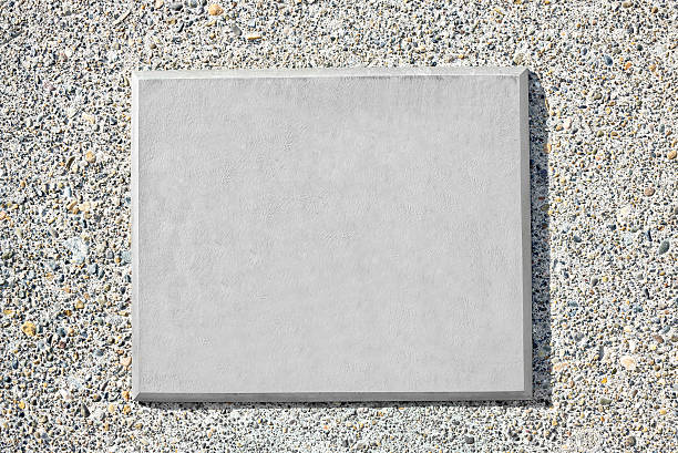 Blank Metal Plaque Blank metal plaque mounted on an old concrete wall. award plaque stock pictures, royalty-free photos & images