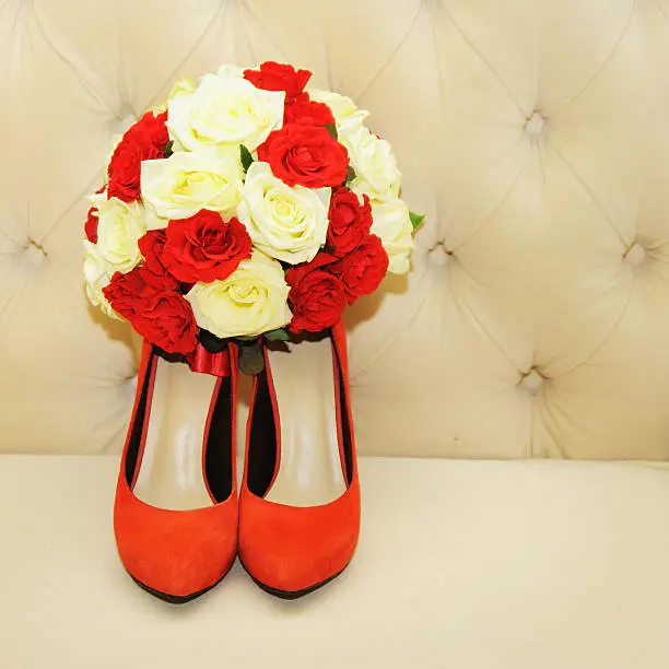 Beautiful bridal bouquet with wedding shoes