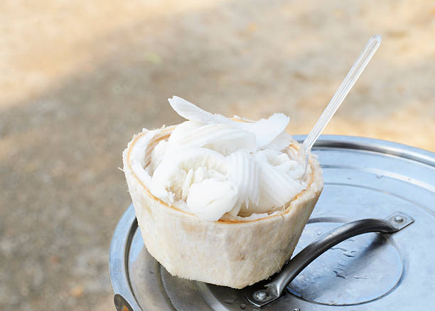 Coconut milk ice cream with coconut shell to eat stock photo