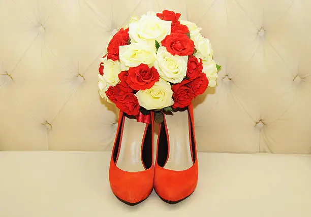 Beautiful bridal bouquet with wedding shoes