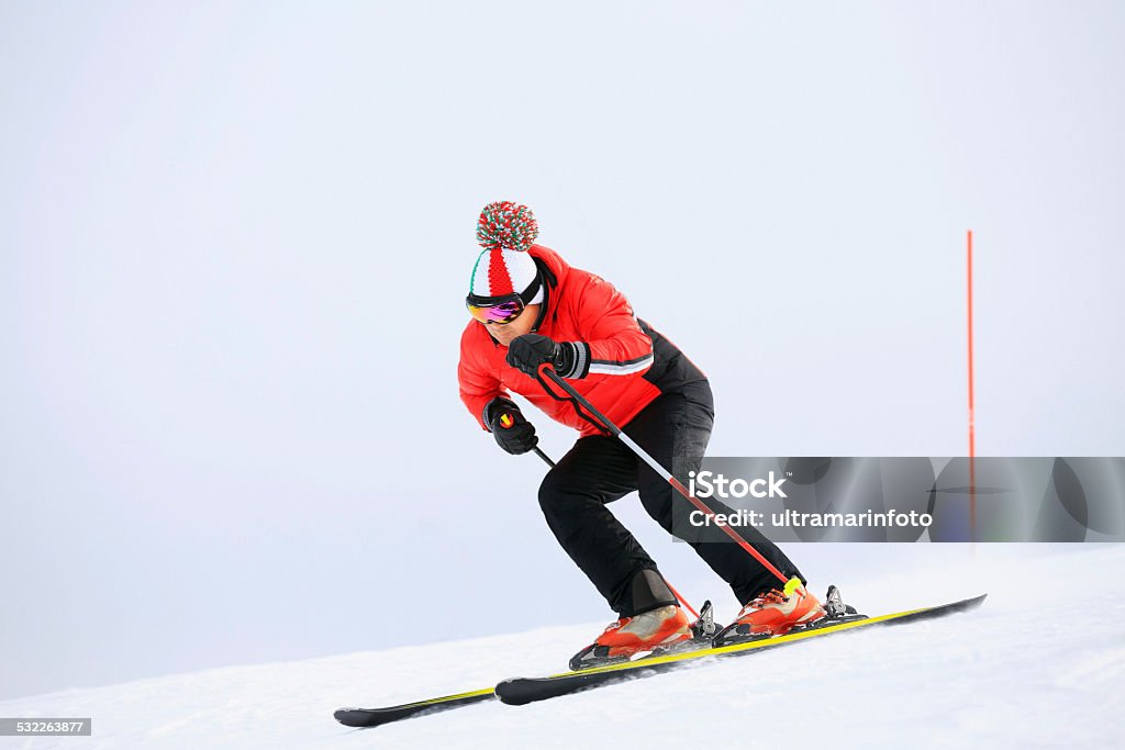 Giant slalom race - Snow Skier Skiing Giant slalom race. Mature Men skier, snow skiing carving at high speed.   Ski Stock Photo