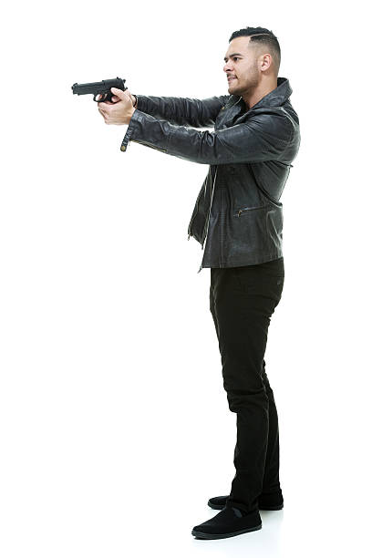 istock Casual man aiming with gun 532264060