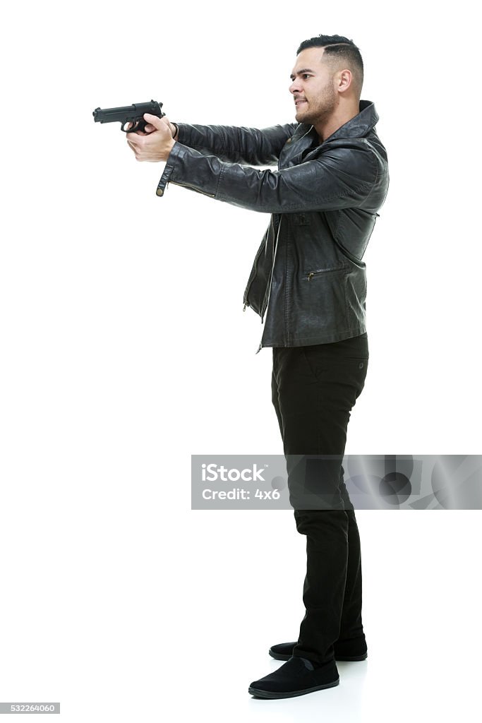 Casual man aiming with gun Casual man aiming with gunhttp://www.twodozendesign.info/i/1.png 20-29 Years Stock Photo