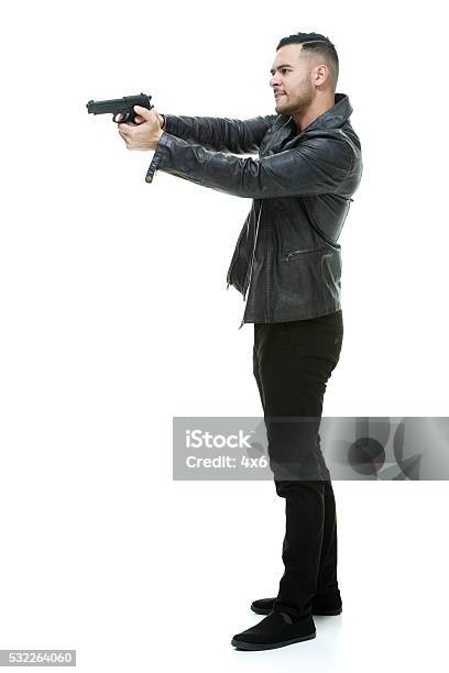 Casual Man Aiming With Gun Stock Photo - Download Image Now - 20-29 Years, Adult, Adults Only