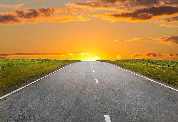 istock sunset over the country highway 532266610