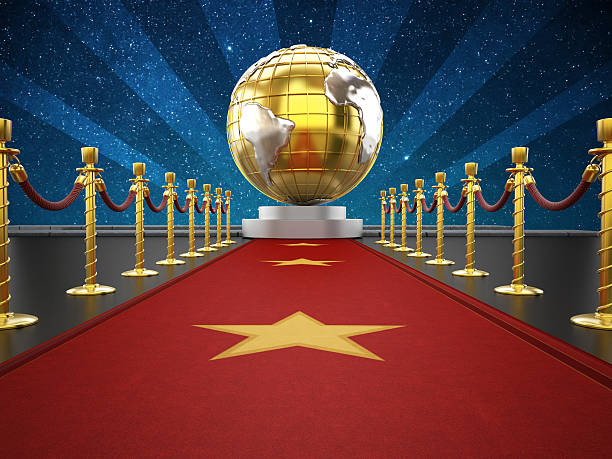 Red carpet, velvet ropes and golden earth model