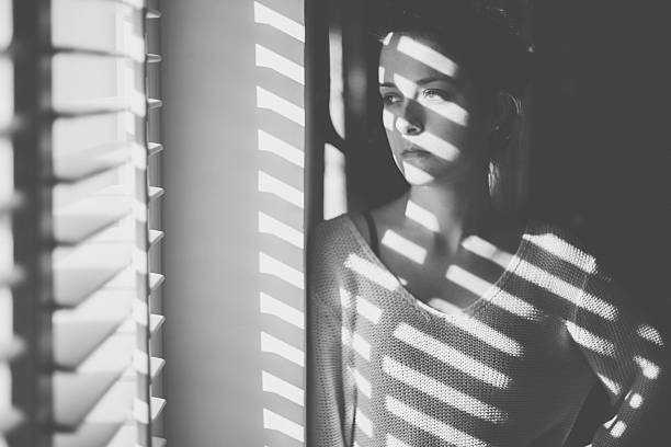 Thoughtful woman at home - copyspace