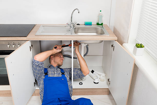 istock Plumber Repairing Sink In Kitchen 532271818