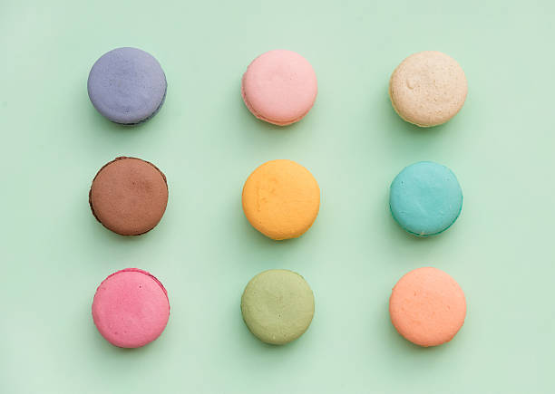 istock Sweet colorful French macaroon biscuits on pastel mint background 532272028