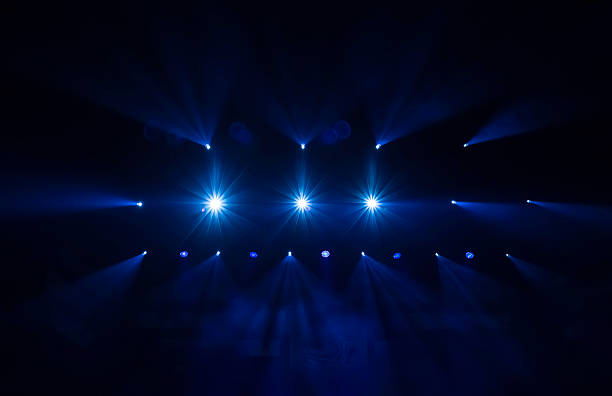 stage lights defocused stage lights/spotlights at the concert stage light stock pictures, royalty-free photos & images