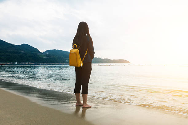 istock Young girl standing on the beach 532273342
