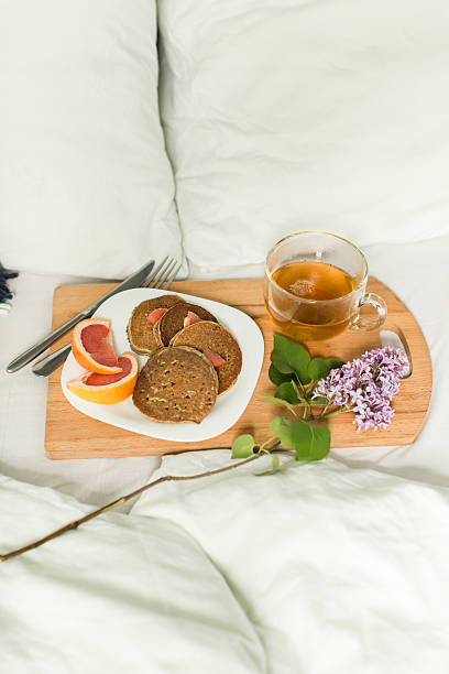 istock Breakfast in bed, Oatmeal pancakes with grapefruit and tea. 532275306