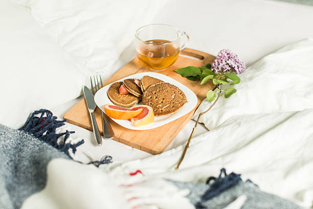 istock Breakfast in bed, Oatmeal pancakes with grapefruit and tea. 532275646